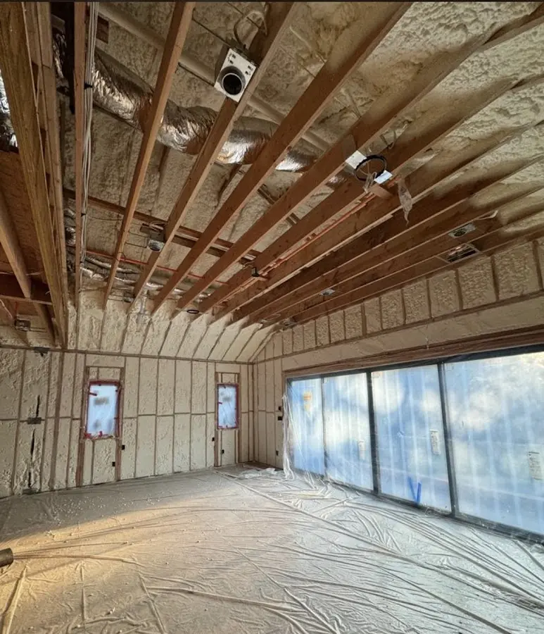 Interior walls and ceiling insulated with spray foam during new construction in Millbrae